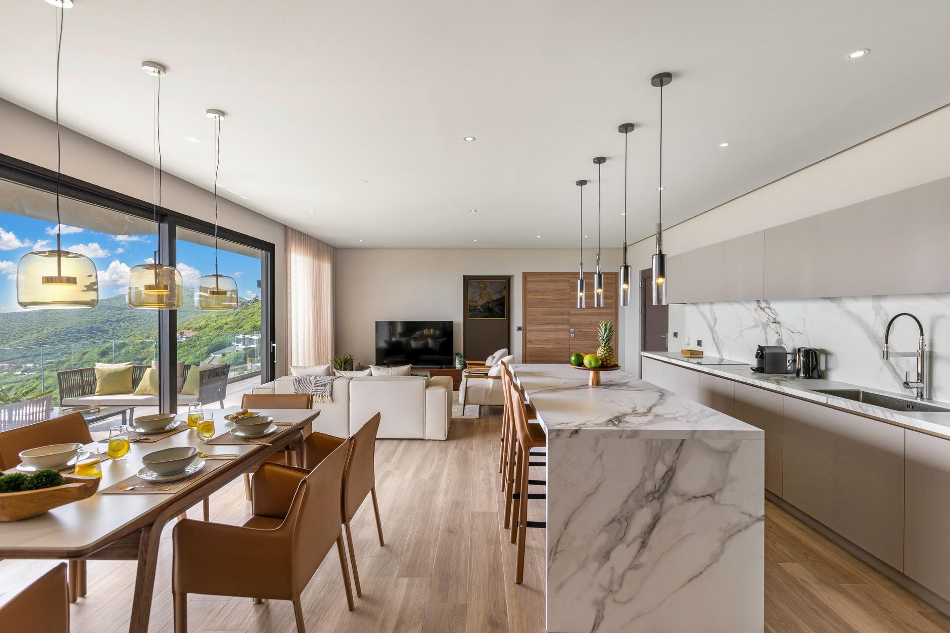 Contemporary Ocean‑View Apartment with Marble‑Veined Waterfall Island & Panoramic Glass Terrace